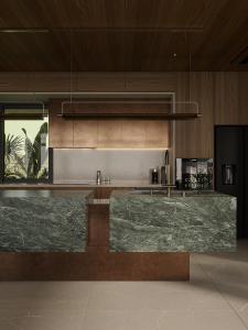 a kitchen with green marble counter tops in a room at 3Z Hotel - Zephyr Zen Zone in Hanoi