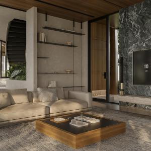 a living room with a couch and a tv at 3Z Hotel - Zephyr Zen Zone in Hanoi