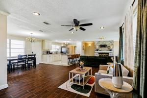 a living room with a couch and a table at Cozy home close to it ALL in Gonzales