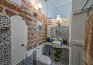 a bathroom with a glass shower and a sink at Private pool heritage villa in Cavelossim area in Velim +28 photos