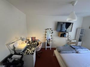 a room with a bed and a desk with a computer at Charming room with wonderful view in Vaasa