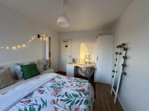 a bedroom with a large bed and a sink at Charming room with wonderful view in Vaasa