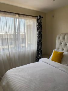 Ένα ή περισσότερα κρεβάτια σε δωμάτιο στο Le rose