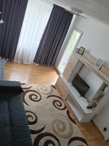 TV a/nebo společenská místnost v ubytování Locul ca acasa + 3 fotografie