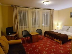 Postel nebo postele na pokoji v ubytování Hotel Metro
