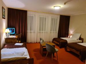 Postel nebo postele na pokoji v ubytování Hotel Metro