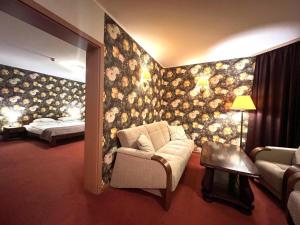 Postel nebo postele na pokoji v ubytování Hotel Metro