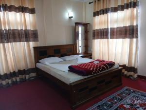 Un ou plusieurs lits dans un hébergement de l'établissement Villa Friendly Faces