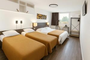 Postel nebo postele na pokoji v ubytování Als Hôtel