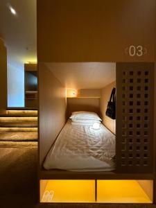 Ένα ή περισσότερα κρεβάτια σε δωμάτιο στο Only Female WOPING HOTEL GUANGZHOU TAIKOO