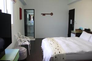 Letto o letti in una camera di Magi House