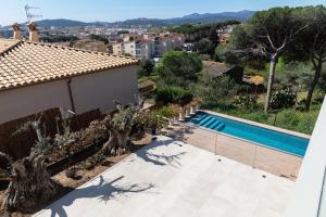 a view of a swimming pool from a house at VILLAS COSETTTE Villa VICENC in Platja  d'Aro