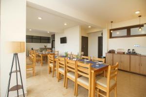 a dining room with a long table and chairs at TVD Hotel Polaris Gangtok Near MG Marg in Gangtok
