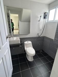 a bathroom with a white toilet and a sink at SW-home R2 in Chiang Mai