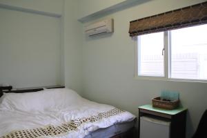Letto o letti in una camera di Magi House