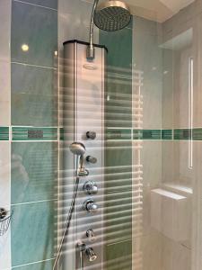 a shower in a bathroom with a glass door at Mountain Vista Apartment in Bled