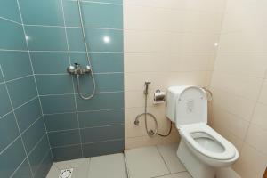 a bathroom with a toilet and a shower at Smile Homes in Zanzibar City +18 photos