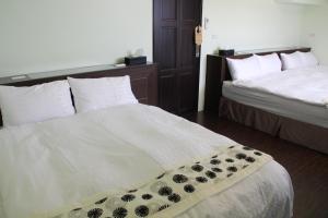 Letto o letti in una camera di Magi House