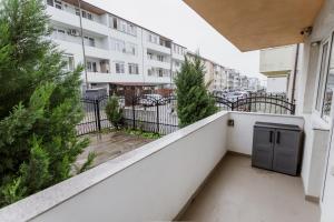 an apartment balcony with a view of a building at APARTAMENT de LUX SIBIU in Sibiu