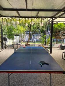 a large ping pong table in a pavilion at Stay Sukoonn Off Beat Staycation in Mohan Chatti