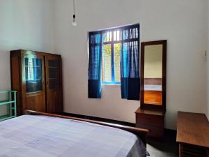 Ένα ή περισσότερα κρεβάτια σε δωμάτιο στο margosa186