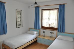 Postel nebo postele na pokoji v ubytování Casa Guido e Laura