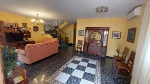 a living room with a couch and a table at Casa Rural Ambroz in Zarza de Granadilla