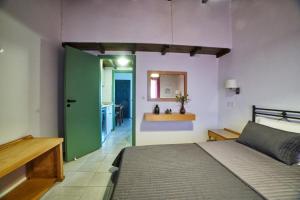 Postel nebo postele na pokoji v ubytování Nancy - Chara Apartments