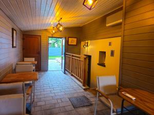 a room with a table and chairs and a hallway at Virgo B&B Biznes Rumia in Rumia