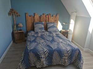 En eller flere senge i et værelse på Villa Les Pélicans