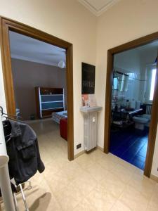 a room with a door leading to a bedroom at La Ramblé in Turin