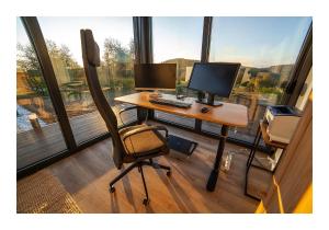 a desk with two monitors and a computer on it at Valley of Bikic in Bikić Do