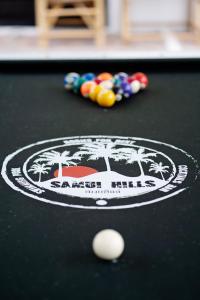 a pool table with a cue ball and afits at Samui Hills Resort in Amphoe Koh Samui