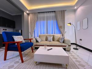 a living room with a couch and a coffee table at Mody Haven in Kampala