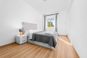 En eller flere senge i et værelse på Orion's Retreat Garajau, Caniço