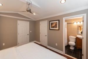 a bathroom with a toilet and a sink at Minimalist Oasis just minutes metro in Hyattsville