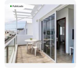 a balcony with a table and a table and chairs at Barloveto 3 apartament in Playa Honda
