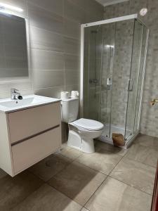 a bathroom with a toilet and a shower and a sink at Barloveto 3 apartament in Playa Honda