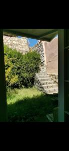a view from a window of a set of stairs at Departamento la candelaria in Algarrobo