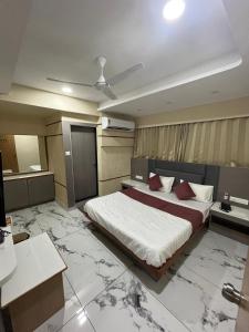 Ένα ή περισσότερα κρεβάτια σε δωμάτιο στο Hotel Nexon Inn