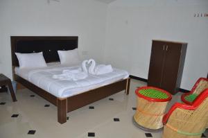 Postel nebo postele na pokoji v ubytování Yash Desert Resort