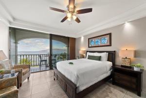 a bedroom with a large bed and a balcony at Lahaina Shores 607 · LS 607 Beachfront Remodeled Studio Stunnin in Lahaina +42 photos