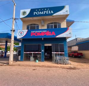 a building with a sign that reads pompeia at Hotel Pompéia em Almeirim in Almeirim
