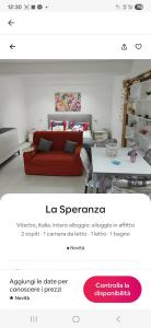 a living room with a red couch and a table at La Speranza in Viterbo