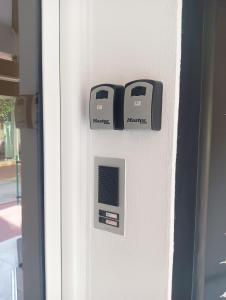 two machines on the side of a door at Orelia in Drama