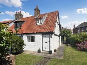 a white house with a red roof at White Cottages in Whitby +8 photos