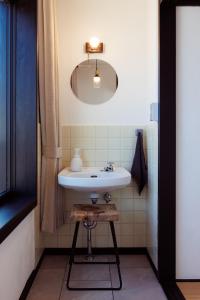 a bathroom with a white sink and a mirror at Shimoda Shirahama Sun Sea - Vacation STAY 17357v in Shimoda +42 photos