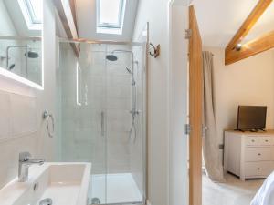a bathroom with a shower and a sink at The Granary - Uk46002 in Rotsea