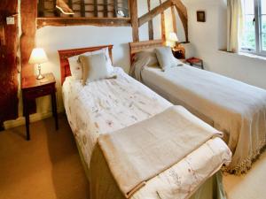 Postel nebo postele na pokoji v ubytování Oddwell Cottage + 5 fotografií