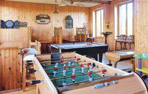 a billiard room with a table and a pool at 5 Bedroom Stunning Home In Quiestede in Quiestède
